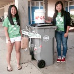 Eco-hero award winners Marissa Wong, left, and Ivy Zhou, leaders of the Holmes Junior High School Green Team, show off a recycling station. Michelle Millet/ Photo courtesy